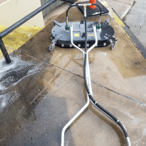 Clean concrete walkway at apartment complex after pressure washing