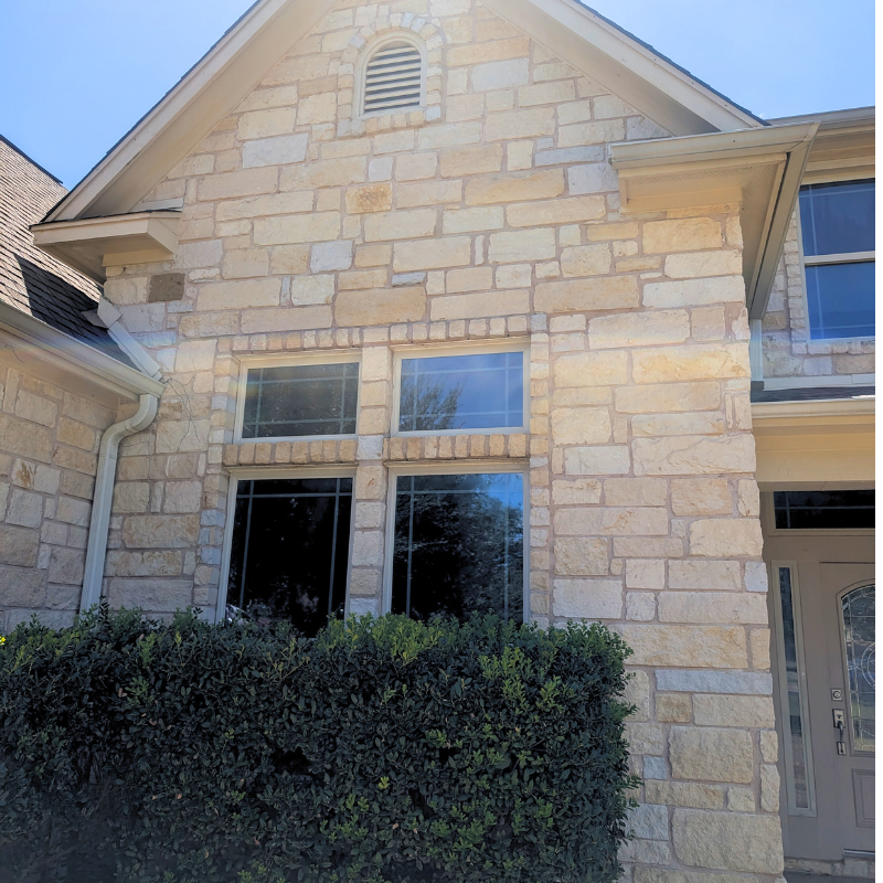 Austin stone house after being power washed by Luke's Pressure Wash